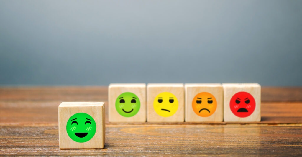Wooden blocks with various emoticons faces