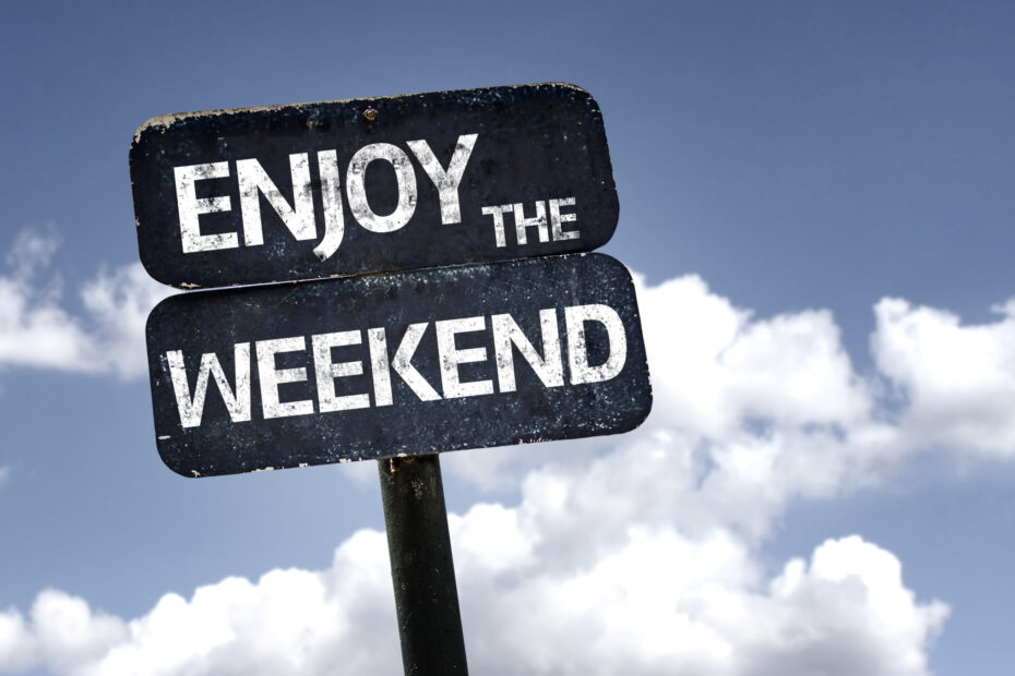 Sign saying enjoy the weekend against clouds